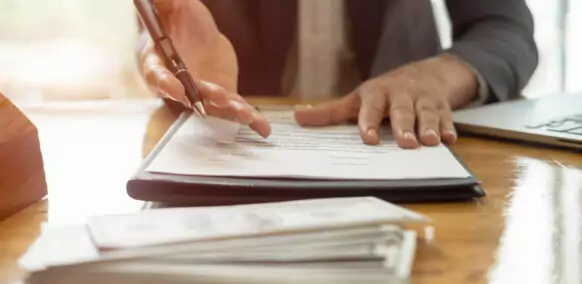 Close,Up,Business,Man,Reaching,Out,Sheet,With,Contract,Agreement