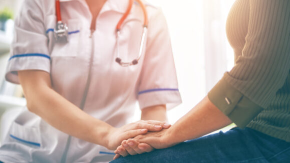 Female,Patient,Listening,To,Doctor,In,Medical,Office.