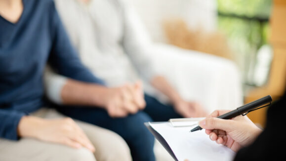 Young,Man,And,Woman,Consulting,With,Professional,Consultant.,Couple,Sitting