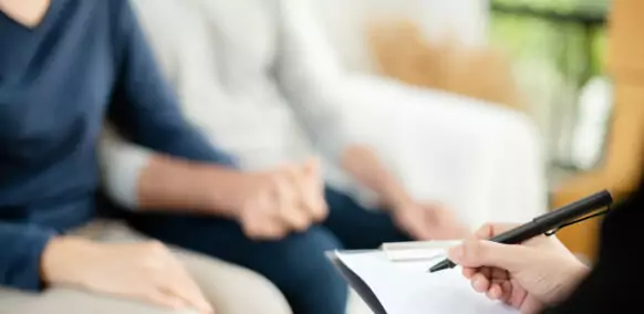 Young,Man,And,Woman,Consulting,With,Professional,Consultant.,Couple,Sitting