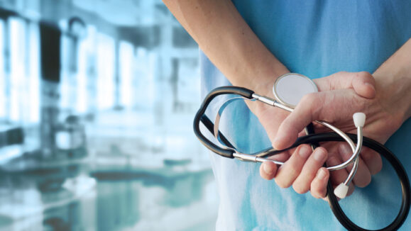 Doctor with a Stethoscope in a Hospital