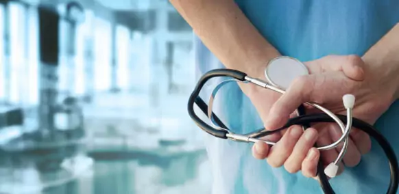 Doctor with a Stethoscope in a Hospital