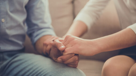 Cropped,Image,Of,Beautiful,Female,Psychologist,Holding,Her,Client's,Hands