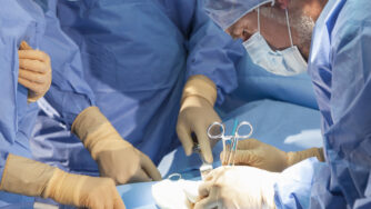 A,Team,Of,Medical,Doctors,And,Male,Surgeon,In,Surgery
