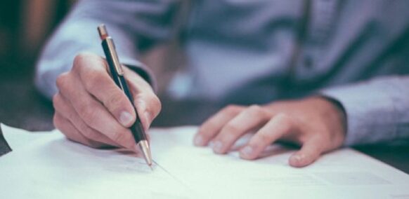 man using pen